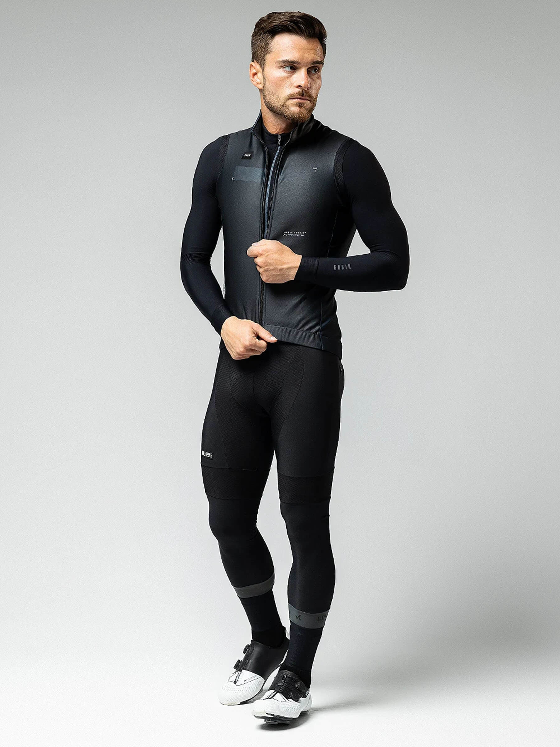 Man wearing GOBIK Thermal XMAX Gilet - Unisex in black, styled for cold weather cycling performance and warmth.
