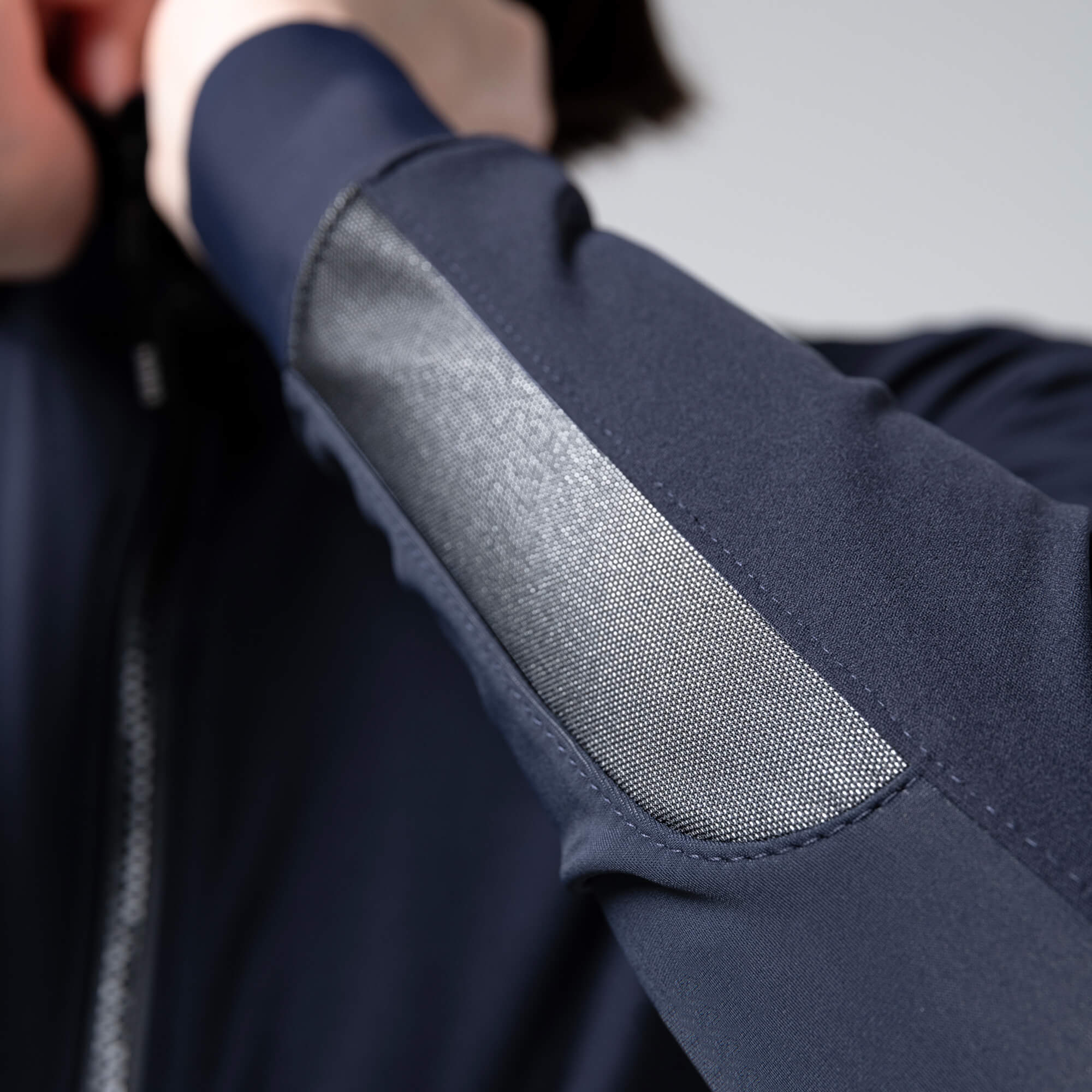Close-up of sleeve detail on GOBIK Armour 2.0 Thermal Jacket - Unisex showing textured fabric panel and stitching design