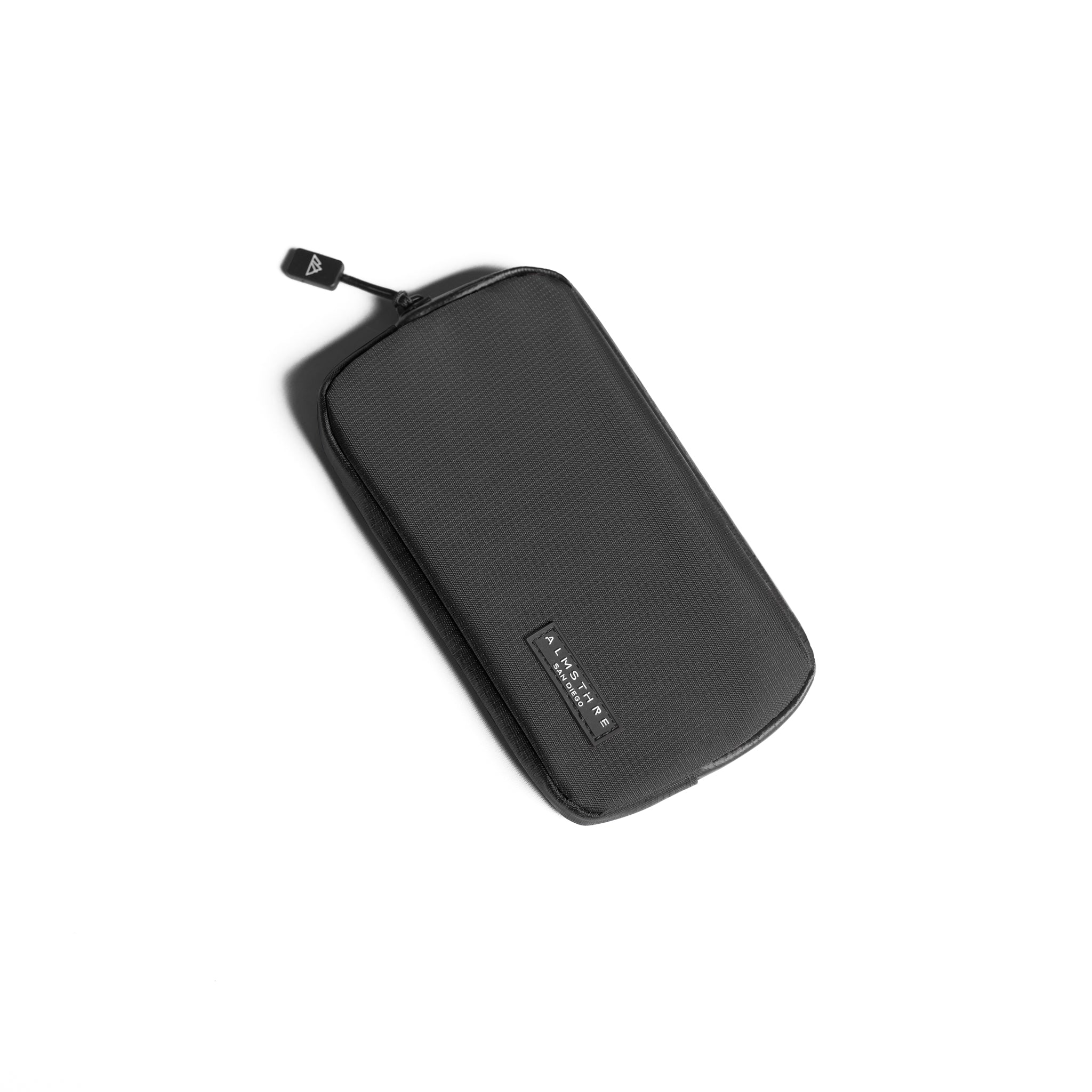 ALMSTHRE Ride Wallet in black ripstop nylon with waterproof zipper designed for secure cycling storage