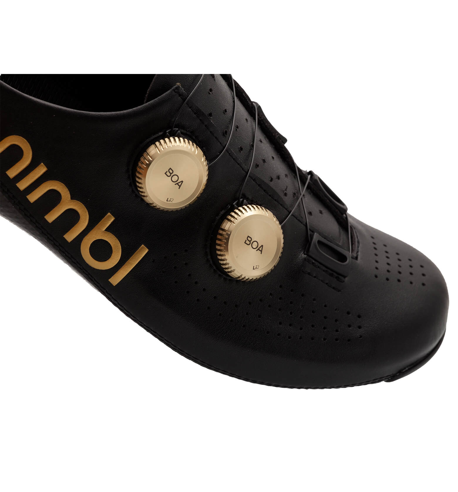 Close-up of black Nimbl ULTIMATE cycling shoe featuring dual gold BOA dials and perforated upper for ventilation