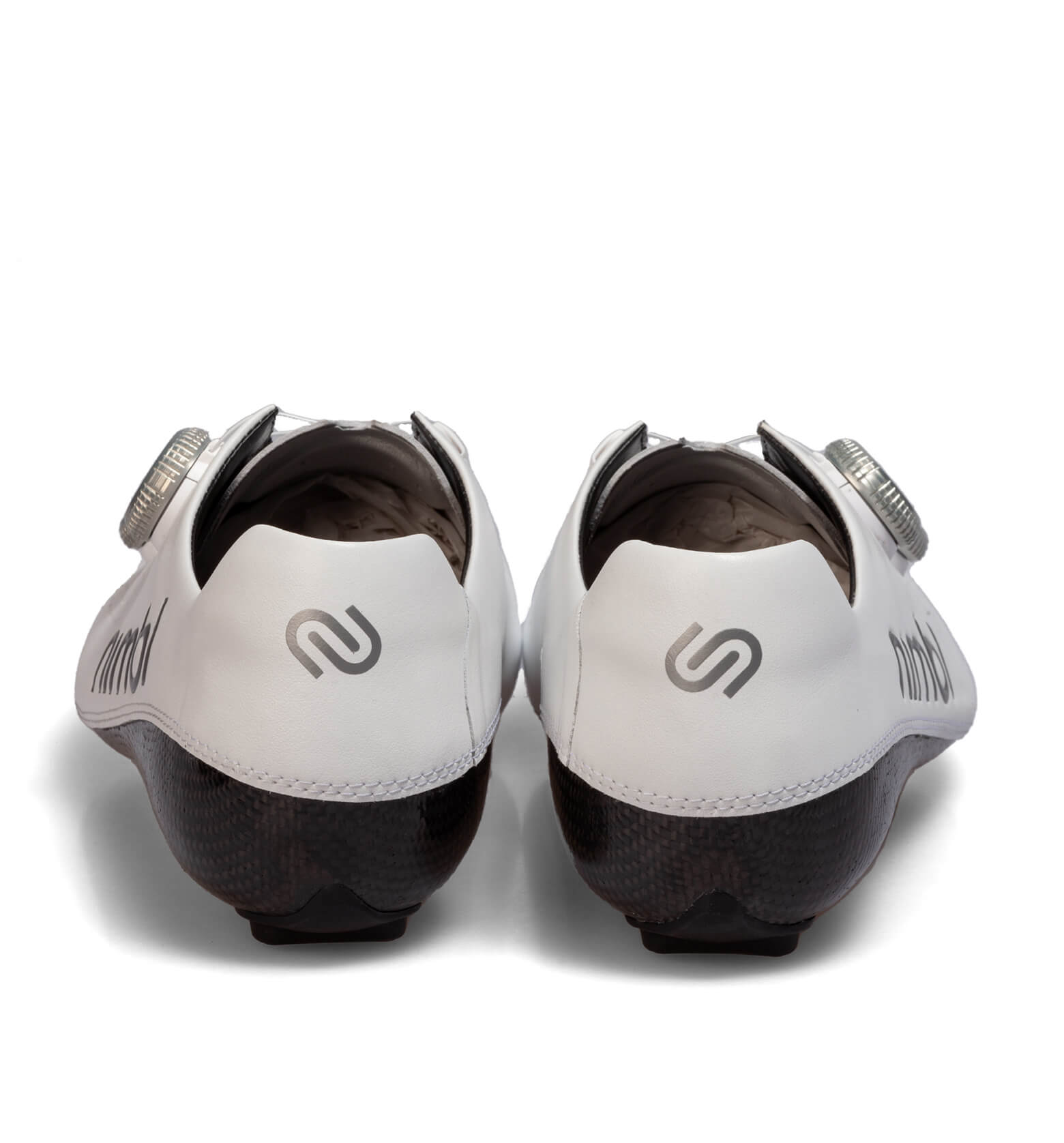 Rear view of white Nimbl ULTIMATE cycling shoes showing heel design and adjustment dial on carbon sole