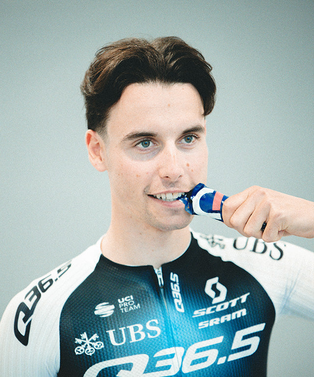 Man in cycling gear using Drink Gel Raspberry | 12-pack sports gel pouch gallery position 2 portrait