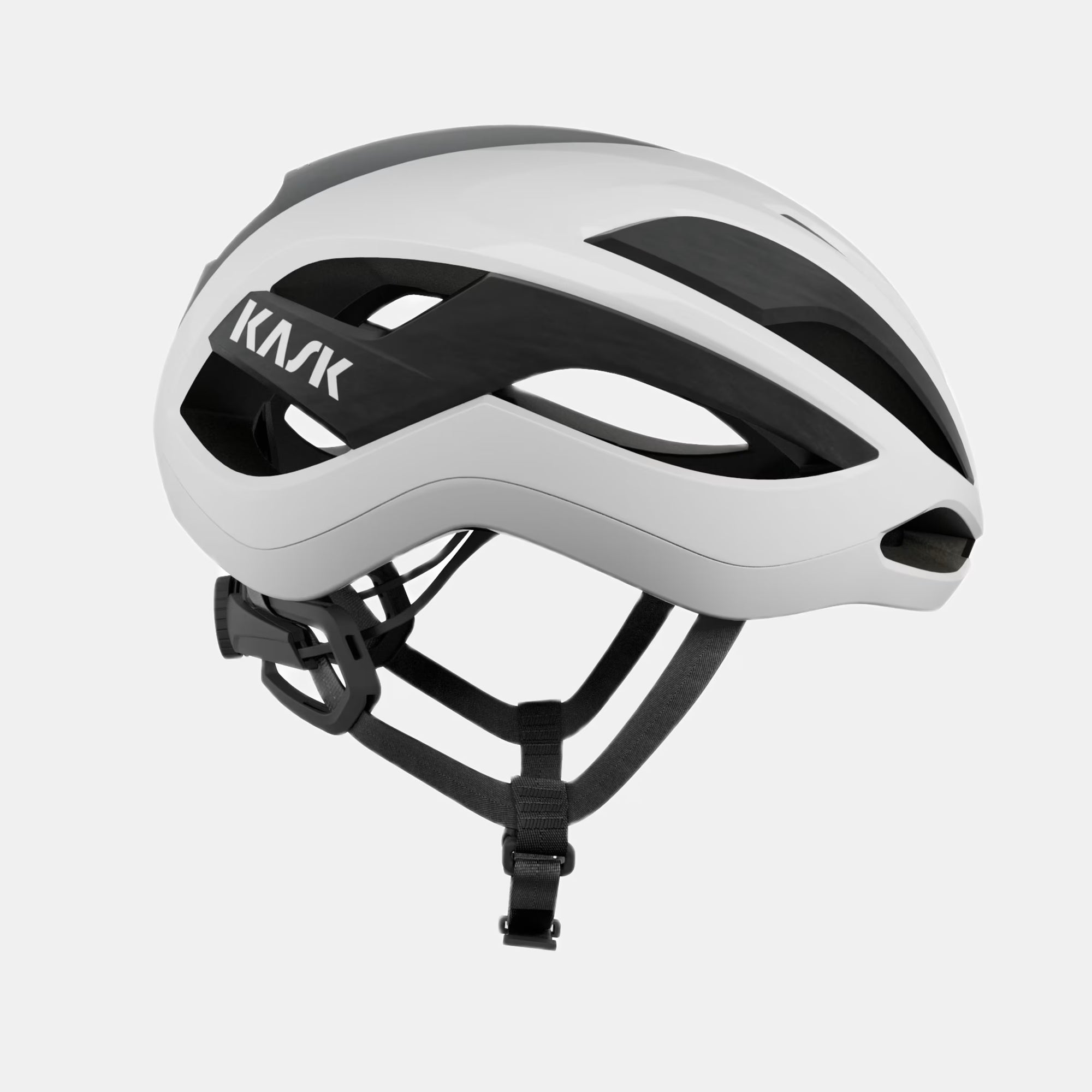 Kask Elemento Helmet  - White side view showing aero design, ventilation channels, and adjustable straps for cycling safety and comfort