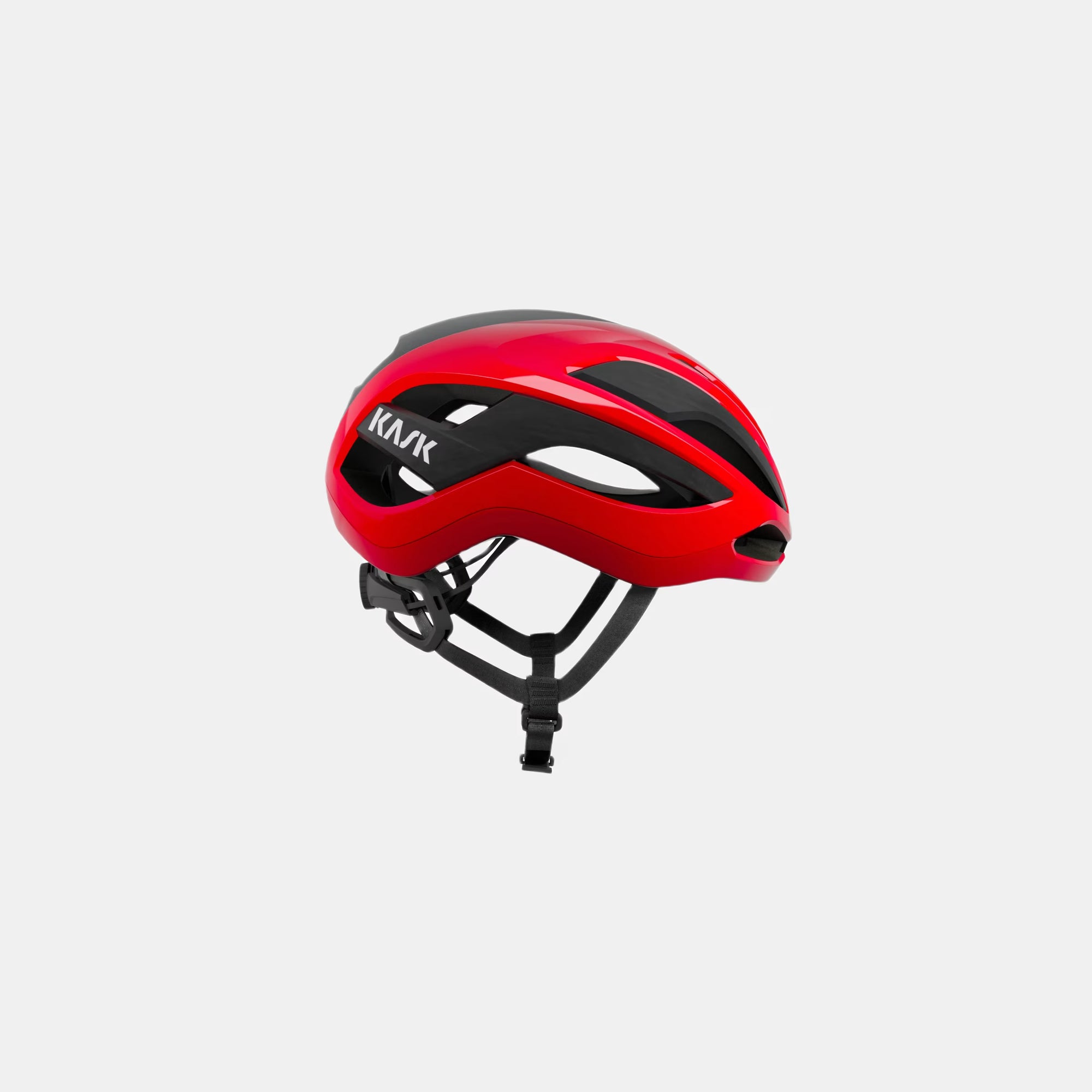 Kask Elemento Helmet  - Red side view showing aerodynamic design and adjustable black straps for road cycling safety and comfort