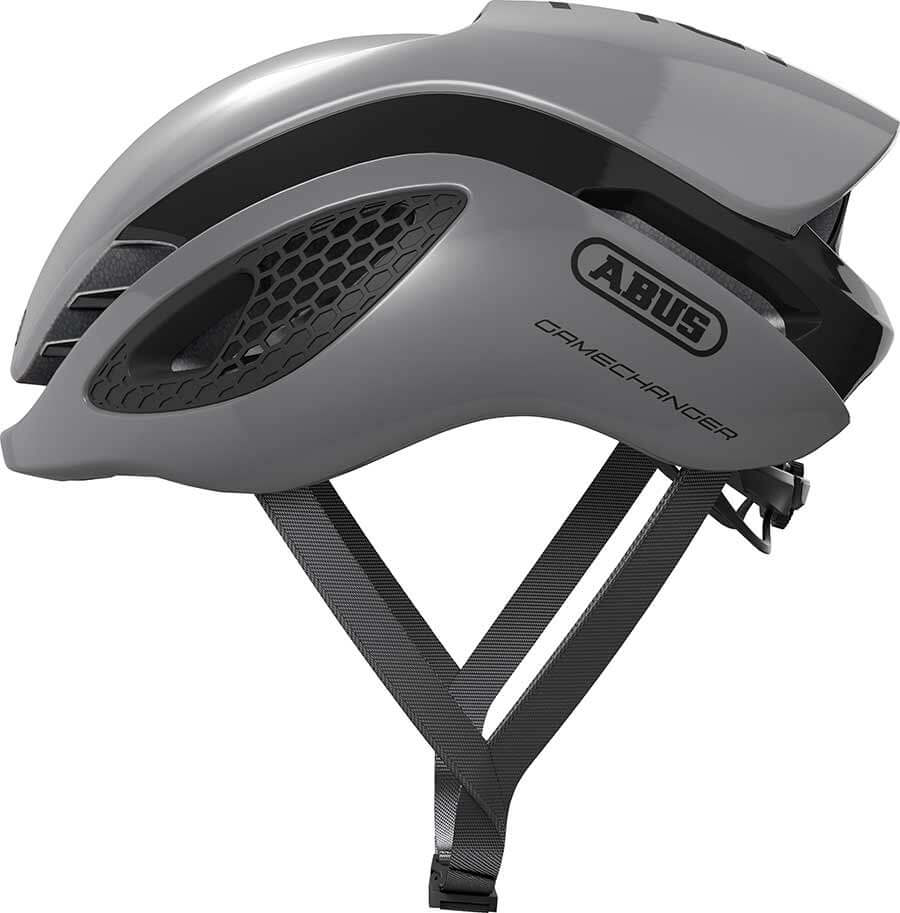 Side view of ABUS GameChanger Helmet in matte gray with aerodynamic design and adjustable straps for racing performance
