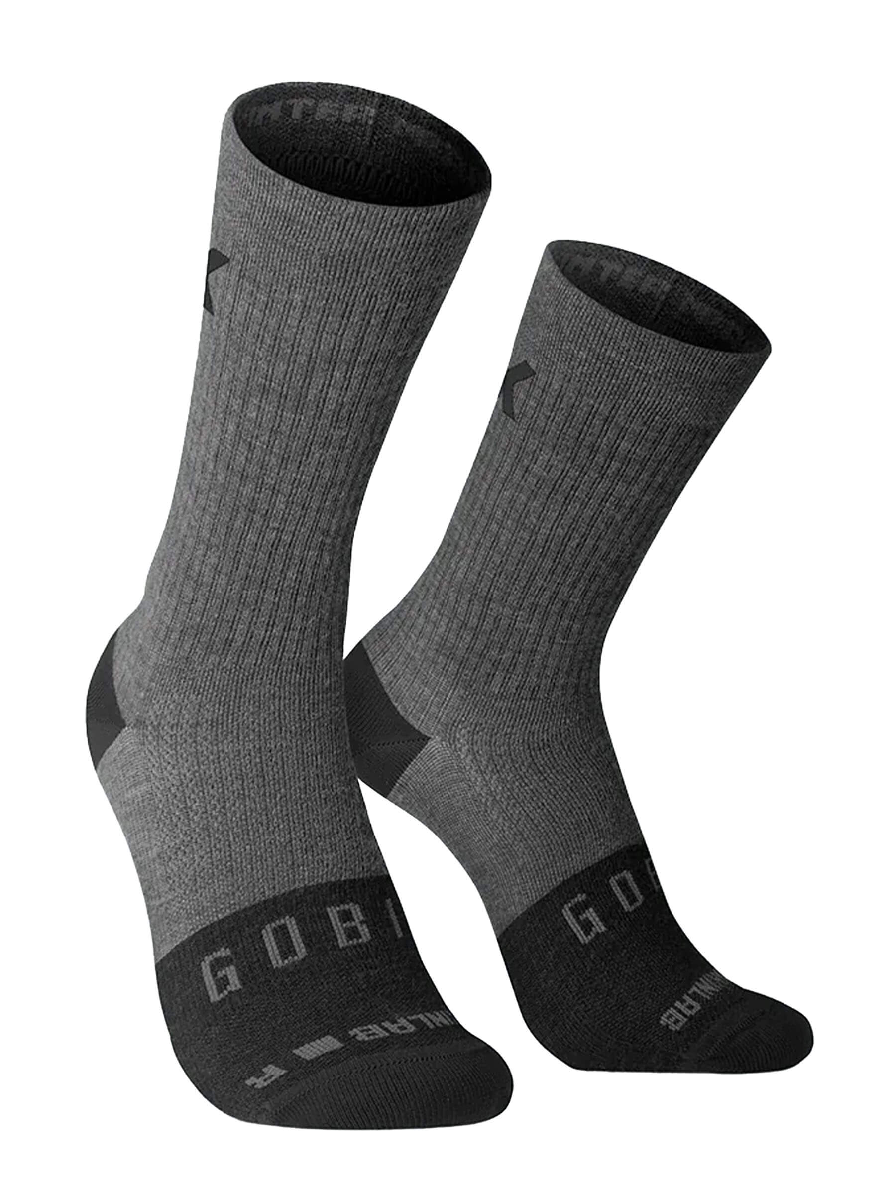 Pair of grey GOBIK Winter Merino Socks designed to provide warmth and comfort in cold weather conditions.