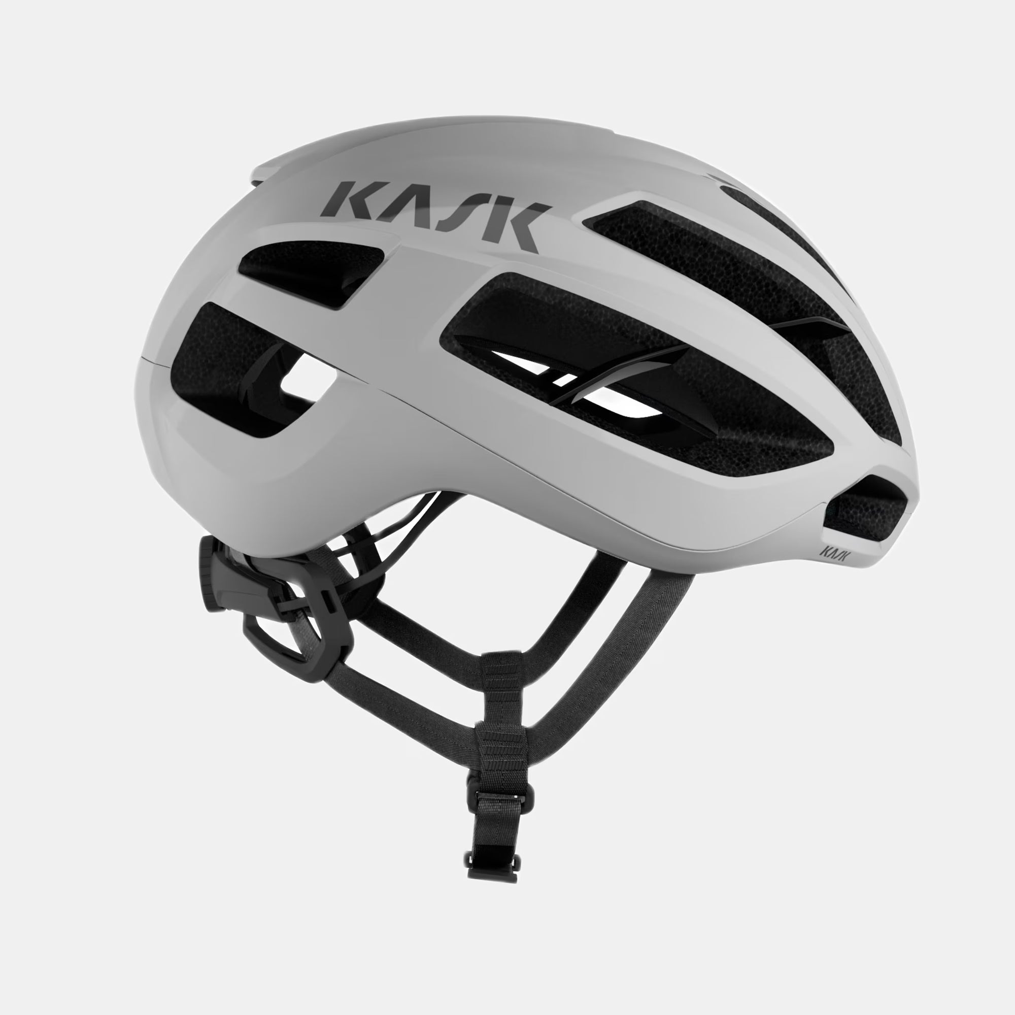 Kask Proton Icon Helmet - White side view showing aerodynamic design and adjustable straps for ventilation and safety
